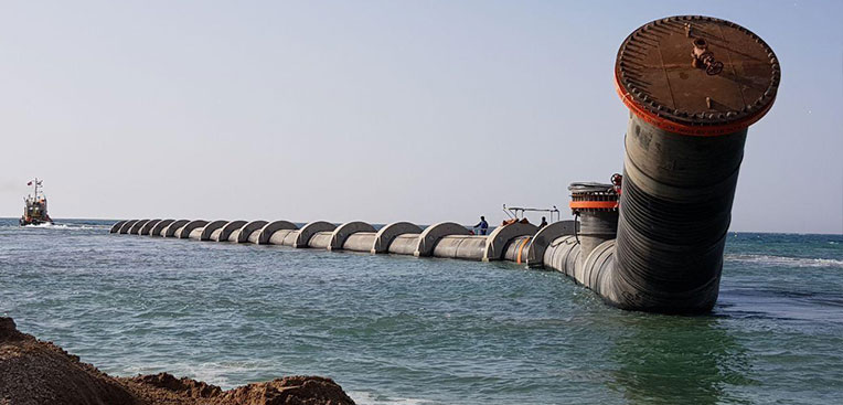 Towing of the 2200mm dia solid wall HDPE spool section into installation position at Barka IWP in Oman